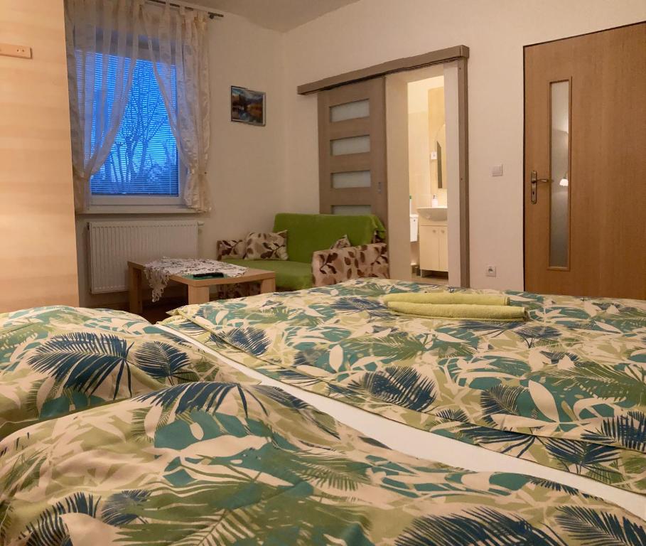 A bed or beds in a room at Vila Lesana