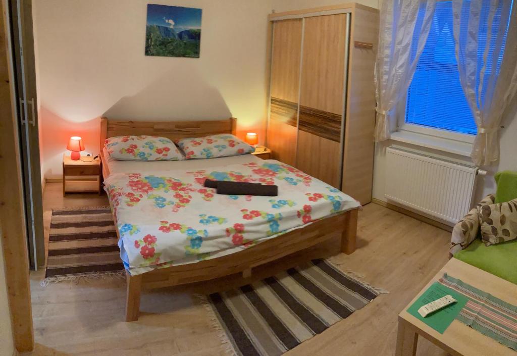 A bed or beds in a room at Vila Lesana