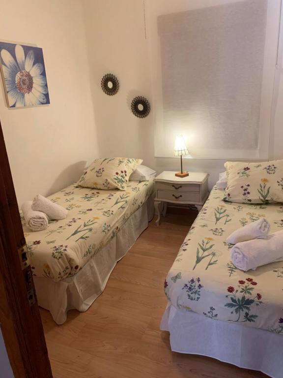 Cama o camas de una habitación en El balcón de Araceli