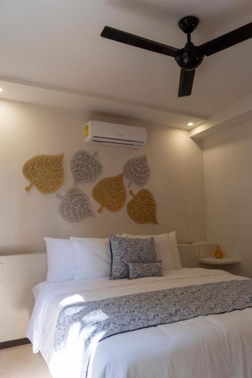 Postel nebo postele na pokoji v ubytování Hotel Circulo Bacalar