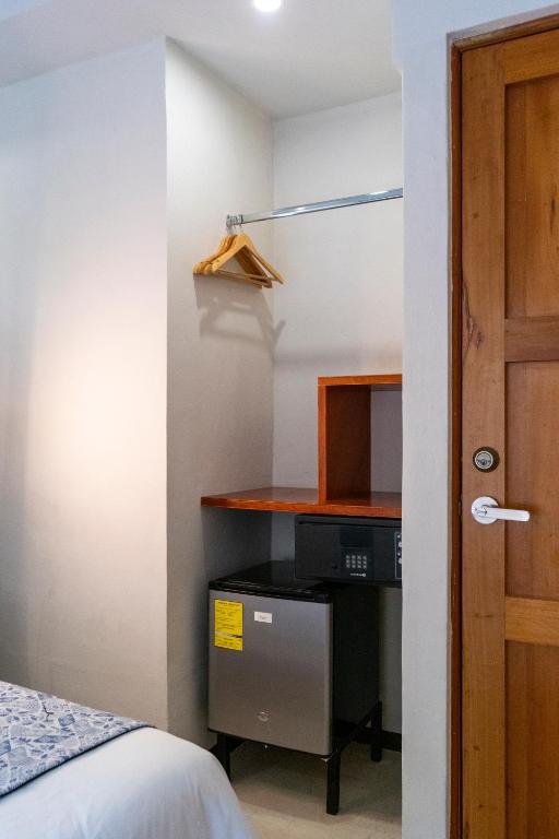Postel nebo postele na pokoji v ubytování Hotel Circulo Bacalar