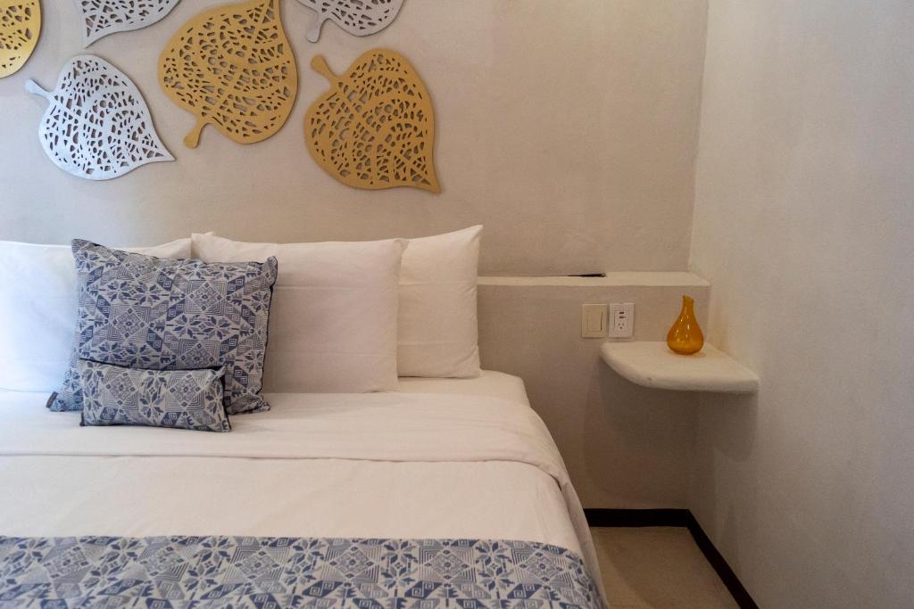 Postel nebo postele na pokoji v ubytování Hotel Circulo Bacalar