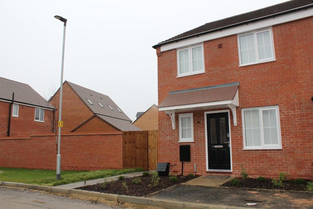 a group of brick houses in a row at Beautiful 1-Bed House in Peterborough in Peterborough