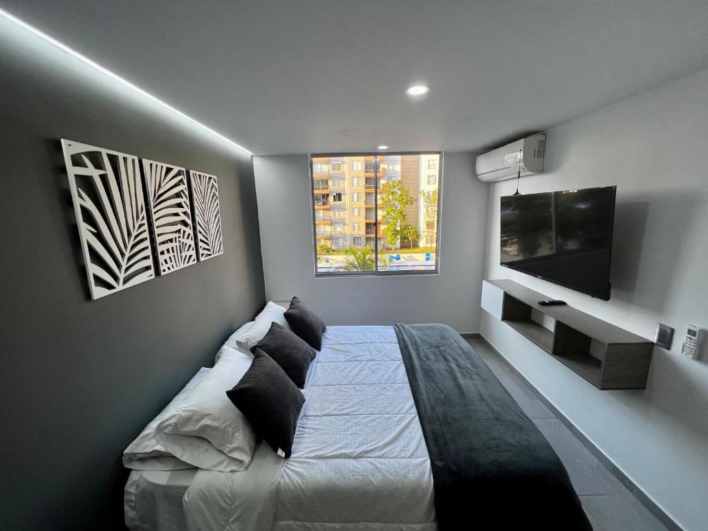 TV a/nebo společenská místnost v ubytování Apartamento luxury Girardot