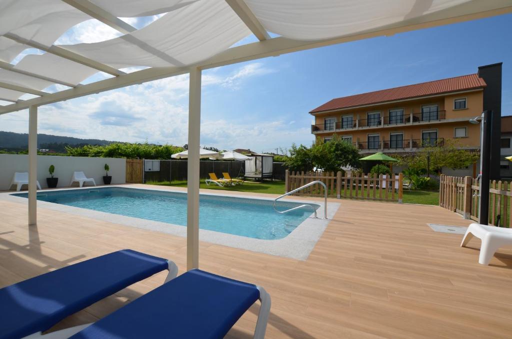 Bazén v ubytovaní Hotel Cachada alebo v jeho blízkosti