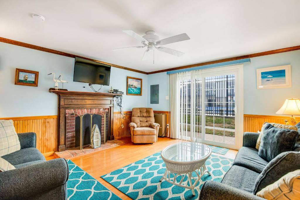 a living room with a couch and a fireplace at Royal Palm Court B5 in Ocean City