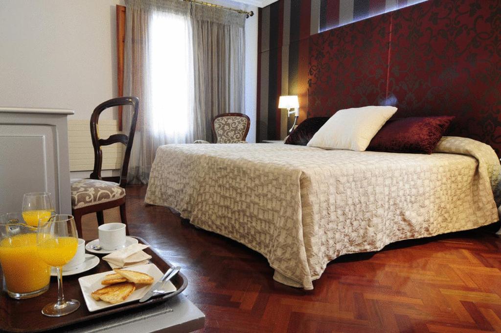 Postel nebo postele na pokoji v ubytování Hotel II Virrey