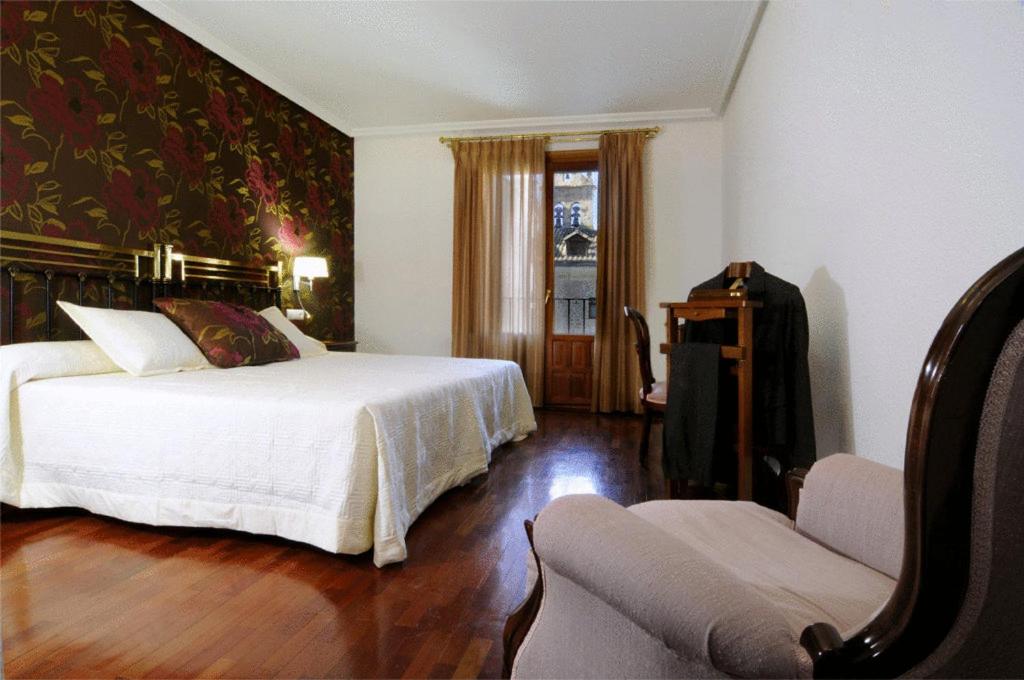 Postel nebo postele na pokoji v ubytování Hotel II Virrey