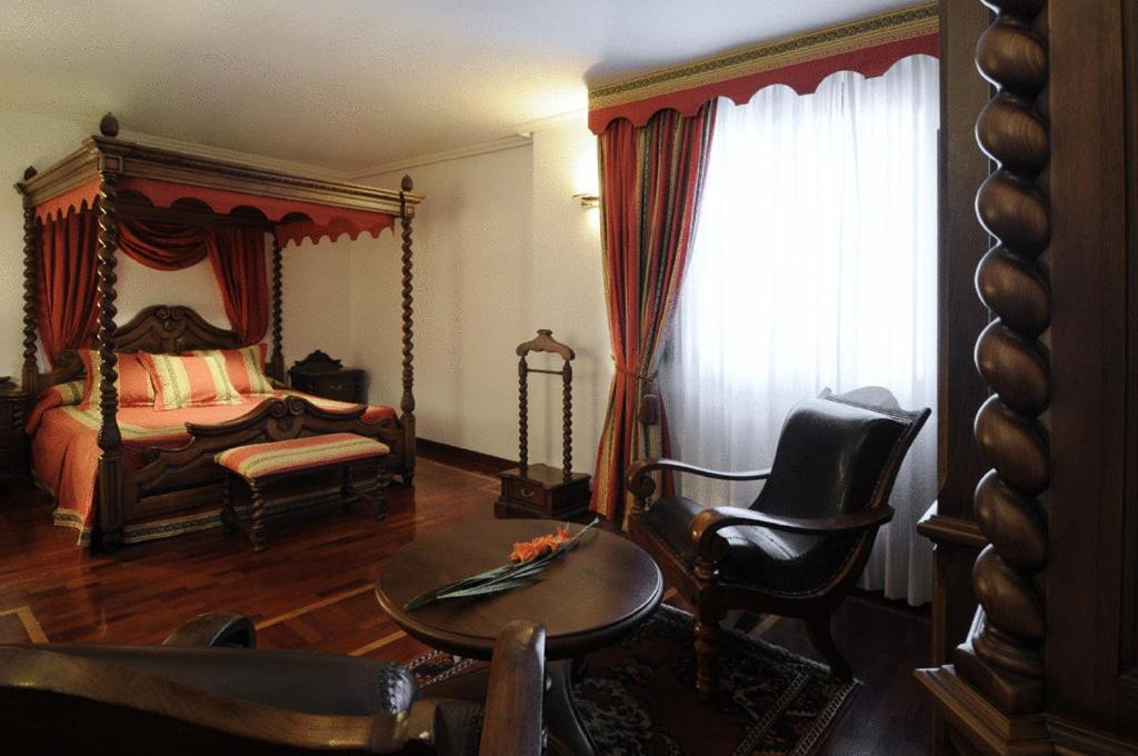 Postel nebo postele na pokoji v ubytování Hotel II Virrey