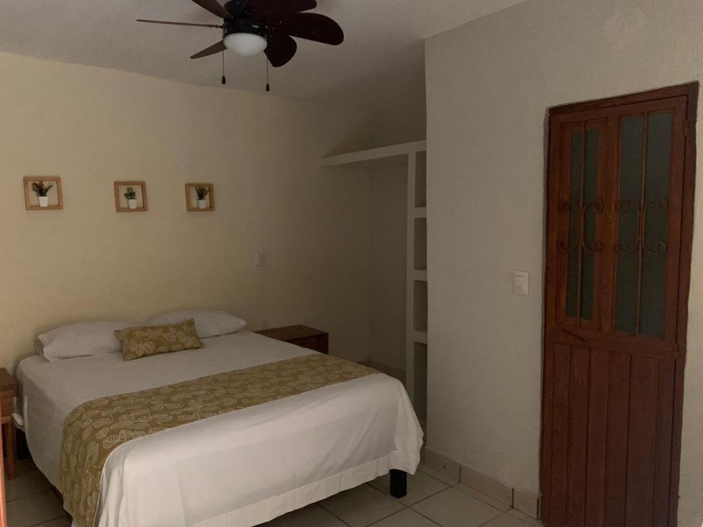 Postel nebo postele na pokoji v ubytování Posada San Jose - Tequila Centro
