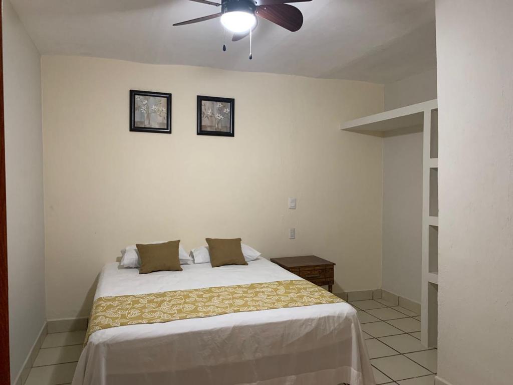 Postel nebo postele na pokoji v ubytování Posada San Jose - Tequila Centro
