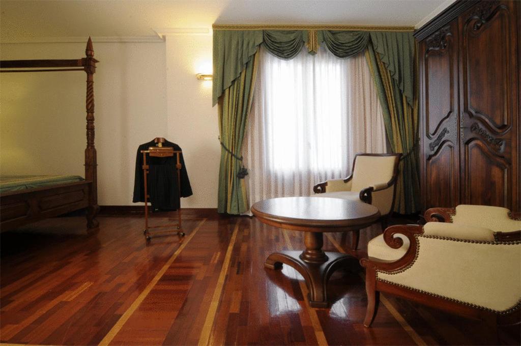 Postel nebo postele na pokoji v ubytování Hotel II Virrey