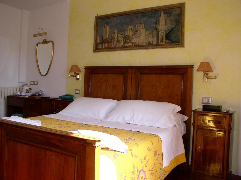Postel nebo postele na pokoji v ubytování Primavera Mini Hotel