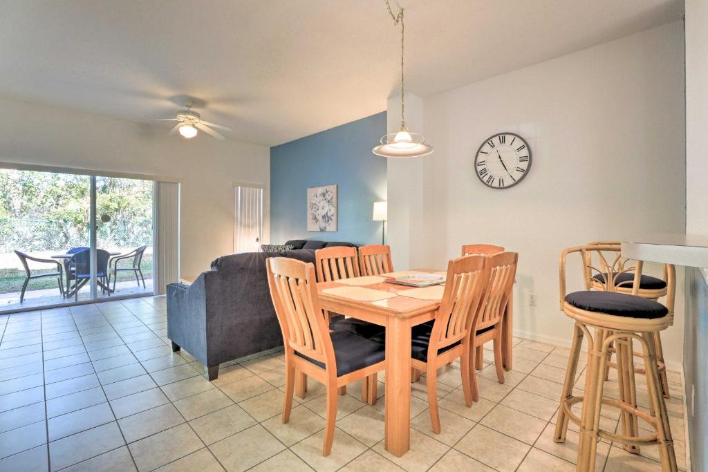 a dining room and living room with a table and chairs at Family-Friendly Lake Berkeley Resorts Home! in Kissimmee