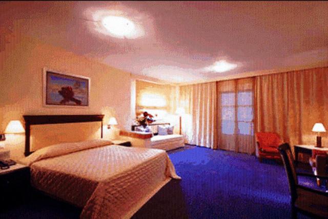Postel nebo postele na pokoji v ubytování Crithoni's Paradise Hotel