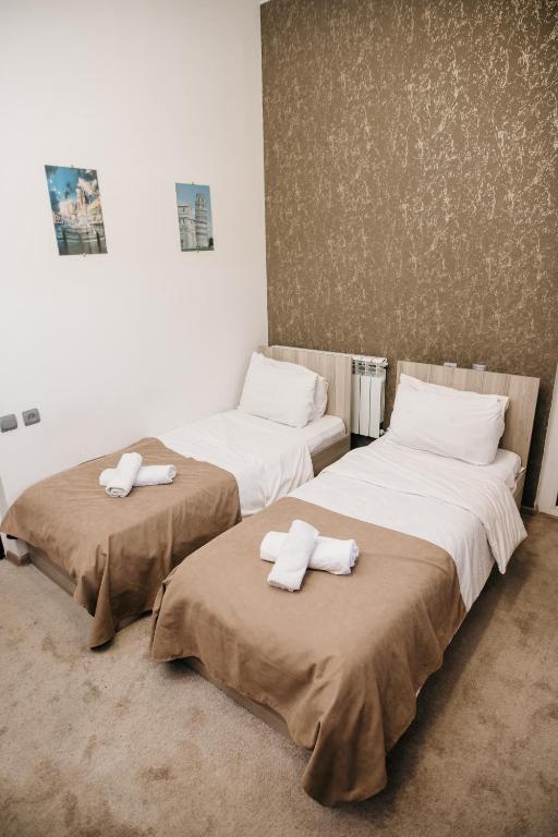 Postel nebo postele na pokoji v ubytování Nuryan Hotel Yerevan