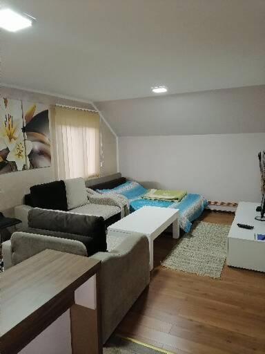 Rúm í herbergi á Apartmani Ognjen