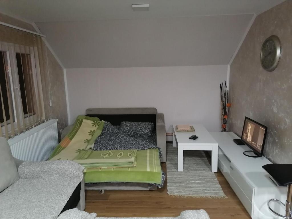 Rúm í herbergi á Apartmani Ognjen