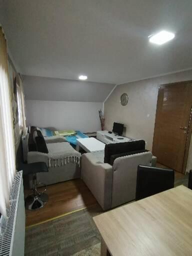 Rúm í herbergi á Apartmani Ognjen