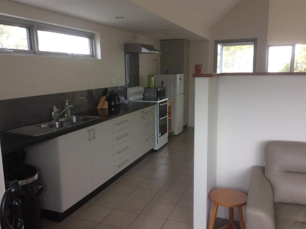 Kuchyň nebo kuchyňský kout v ubytování Hanover Bay Apartments