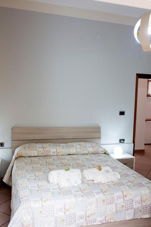 Postel nebo postele na pokoji v ubytování B&B L'Aurora CAPUA