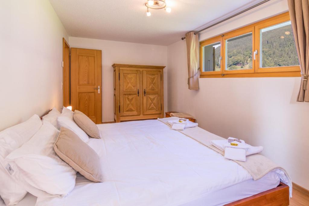 Postel nebo postele na pokoji v ubytování Chalet Aquila 2