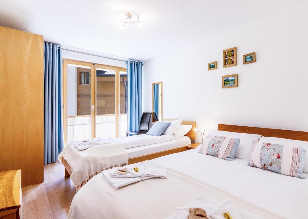 Postel nebo postele na pokoji v ubytování Chalet Aquila 2