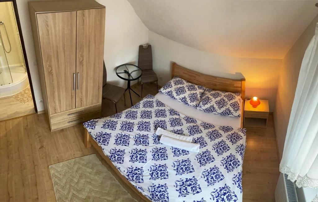 A bed or beds in a room at Vila Lesana