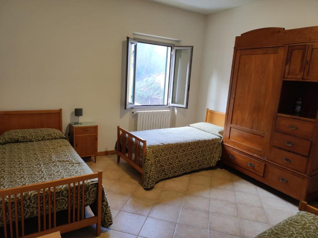 Posteľ alebo postele v izbe v ubytovaní QOELET - B&B Etico e Sociale