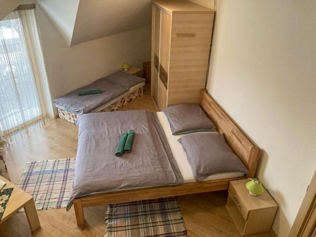 A bed or beds in a room at Vila Lesana