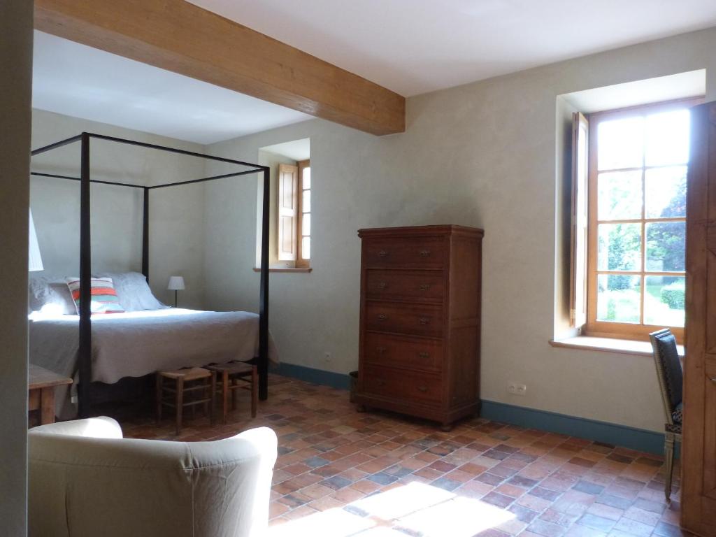 Postel nebo postele na pokoji v ubytování Manoir du Plessis au Bois