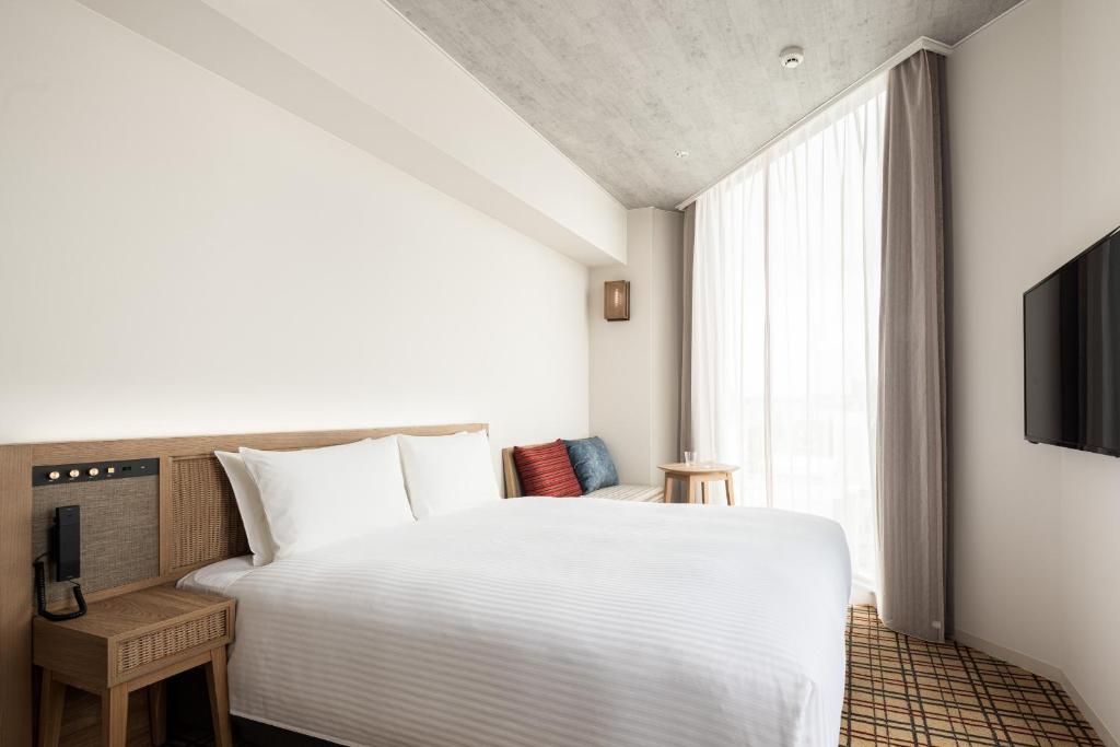 Nest Hotel Naha Kumoji電視和／或娛樂中心