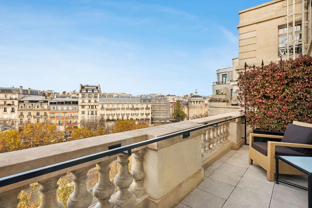 a balcony with a view of the city at Shangri-La Paris in Paris