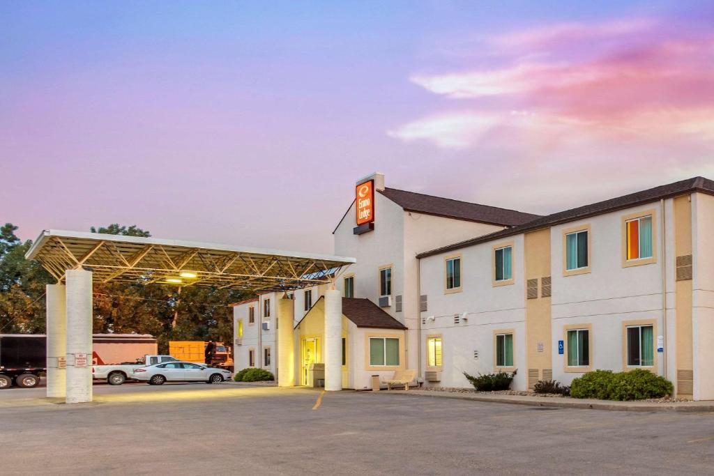 a large white building with a sign on it at Econo Lodge in Belle Fourche