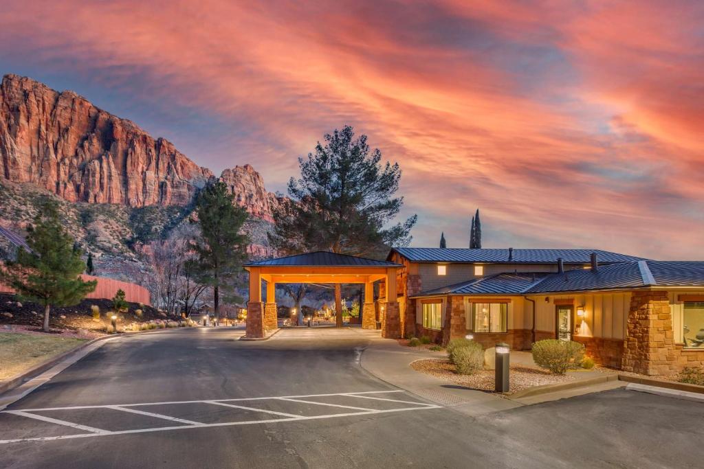 
a large building with a view of the mountains at Best Western Plus Zion Canyon Inn & Suites in Springdale
