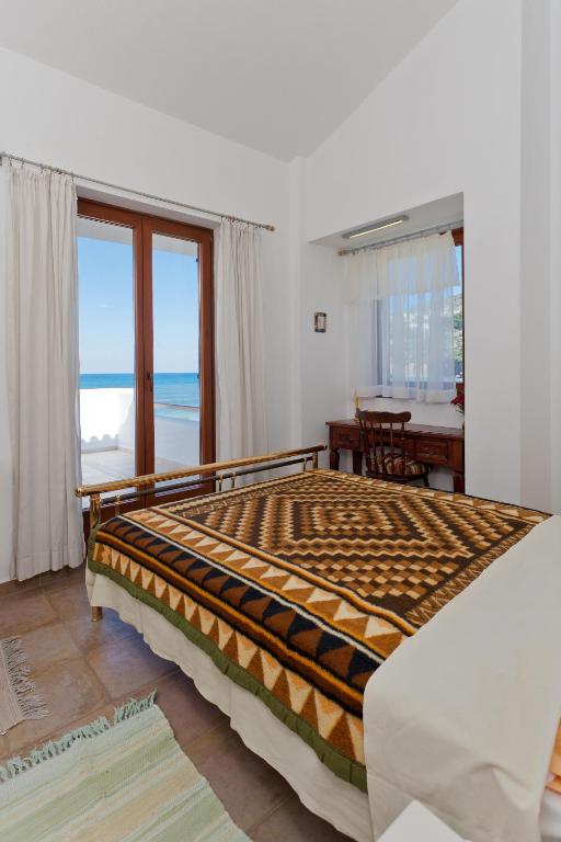 Postel nebo postele na pokoji v ubytování Del Sol Skopelos
