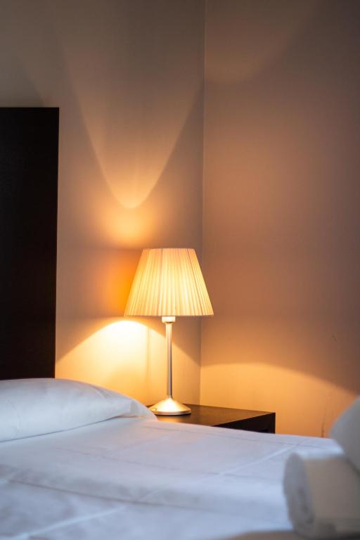 Postel nebo postele na pokoji v ubytování Hotel Cavour by LVG Hotel Collection