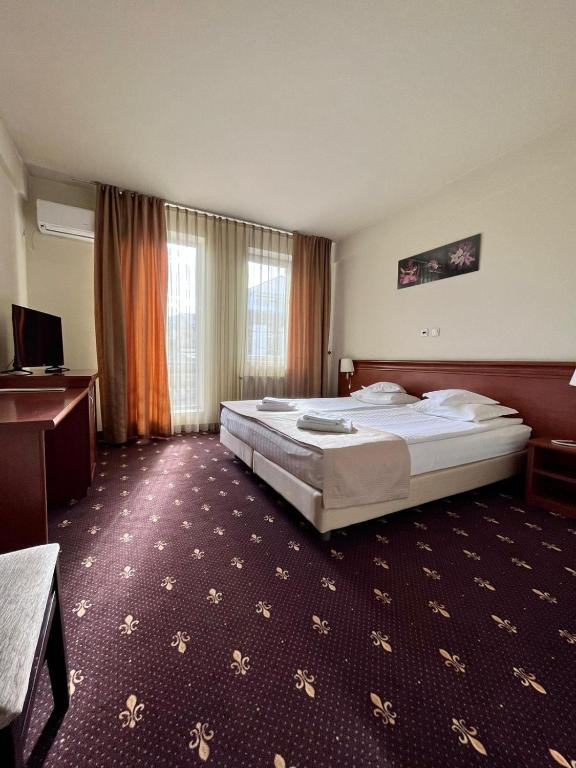 Postel nebo postele na pokoji v ubytování Hotel Seven