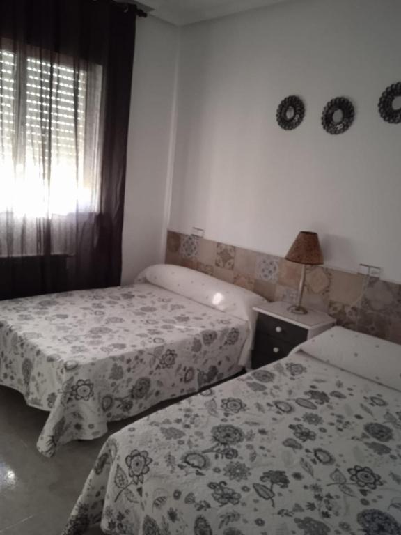Postel nebo postele na pokoji v ubytování Vivienda uso turistico Los Nogales