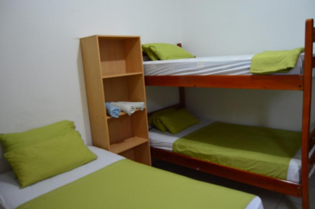 Postel nebo postele na pokoji v ubytování Hostal El Naufrago 1