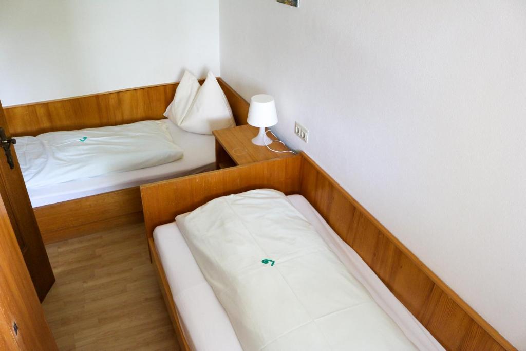 Postel nebo postele na pokoji v ubytování Haus Alpina