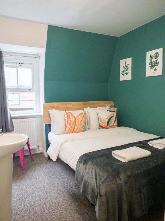 Postel nebo postele na pokoji v ubytování Smart Hyde Park Inn