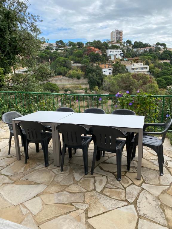 a table and chairs on a patio with a view at Canyelles BBQ Apartment in Lloret de Mar