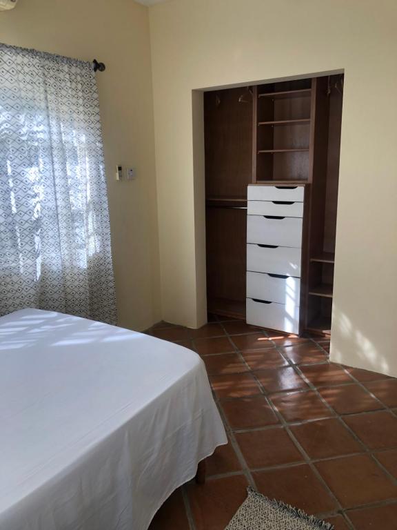 Postel nebo postele na pokoji v ubytování Pura Vida Jamaica