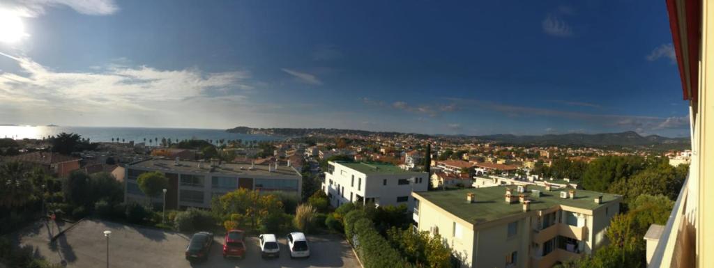 a view of a city with buildings and the water at Charming Studio With Terrace And 180 Sea View in Six-Fours-les-Plages