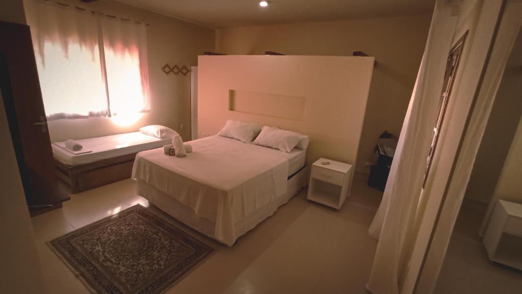 Postel nebo postele na pokoji v ubytování Abrolhos Dive Inn