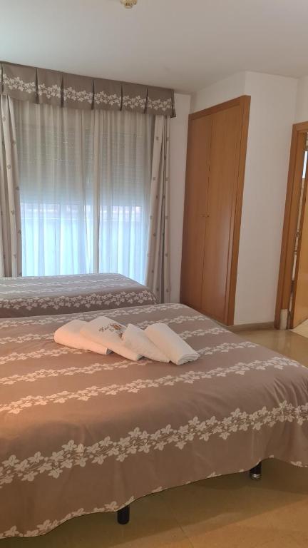 Postel nebo postele na pokoji v ubytování Hotel Cosmos Tarragona