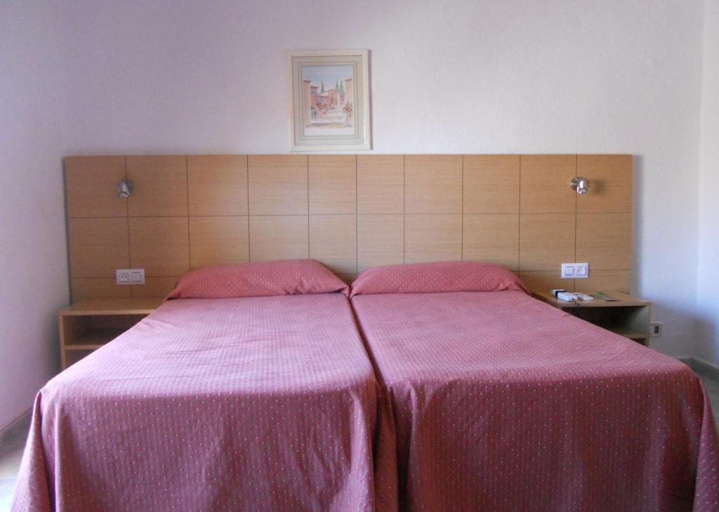 Cama o camas de una habitación en Hotel Sacratif