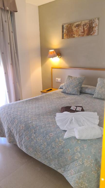 Postel nebo postele na pokoji v ubytování Hotel Cosmos Tarragona
