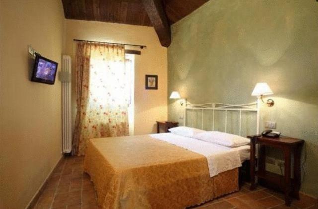 Postel nebo postele na pokoji v ubytování Residence Borgo Da Mare